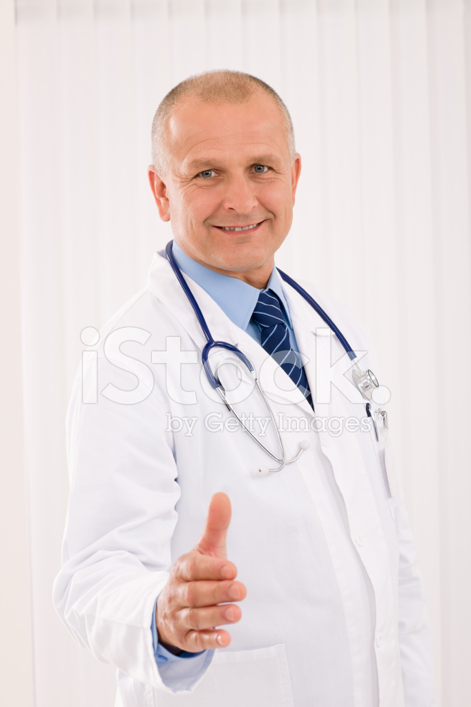 18661324-senior-doctor-male-smiling-welcoming-handshake
